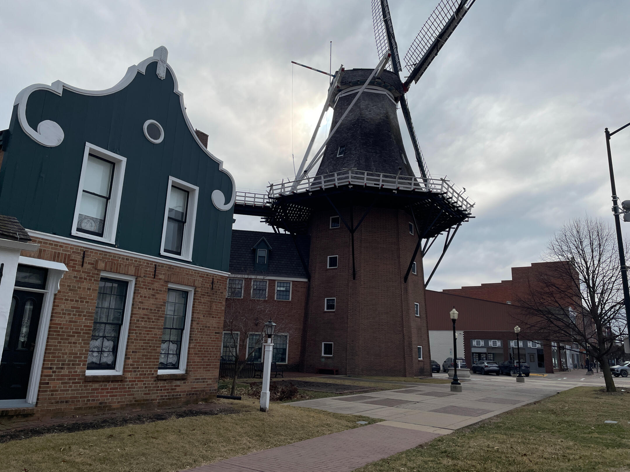 Vermeer Windmill and adjacent Dutch‑style buildings at Pella’s Historical Village.